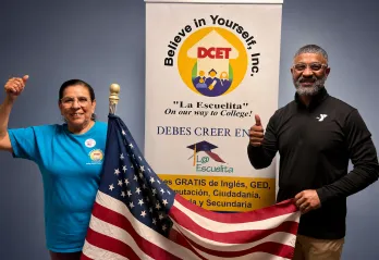 Juanita Estrada and Daniel Edwards at the Grand Prairie Family YMCA, representing DCET and La Escuelita’s adult literacy program