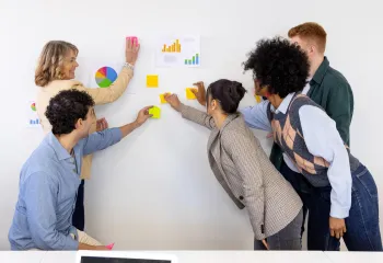 people with post-it notes collaborating