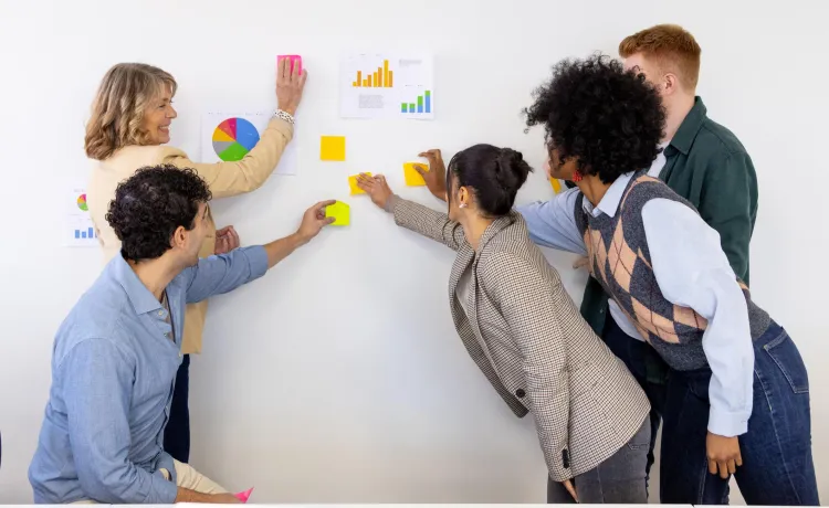 people with post-it notes collaborating