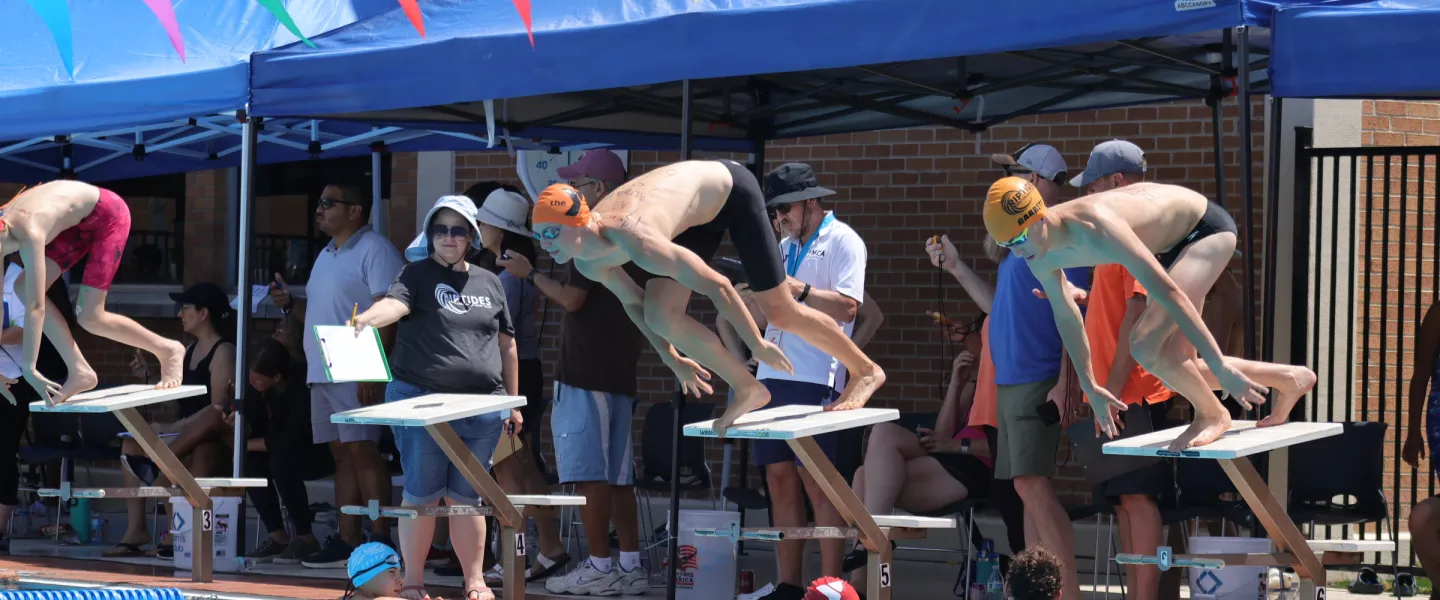 competitive swimmers waiting for start