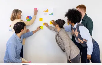 people with post-it notes collaborating